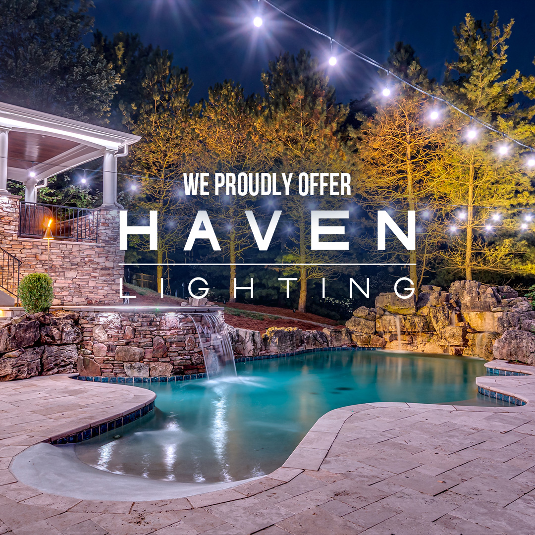 Poolside patio and home lit with roofline and landscape lighting